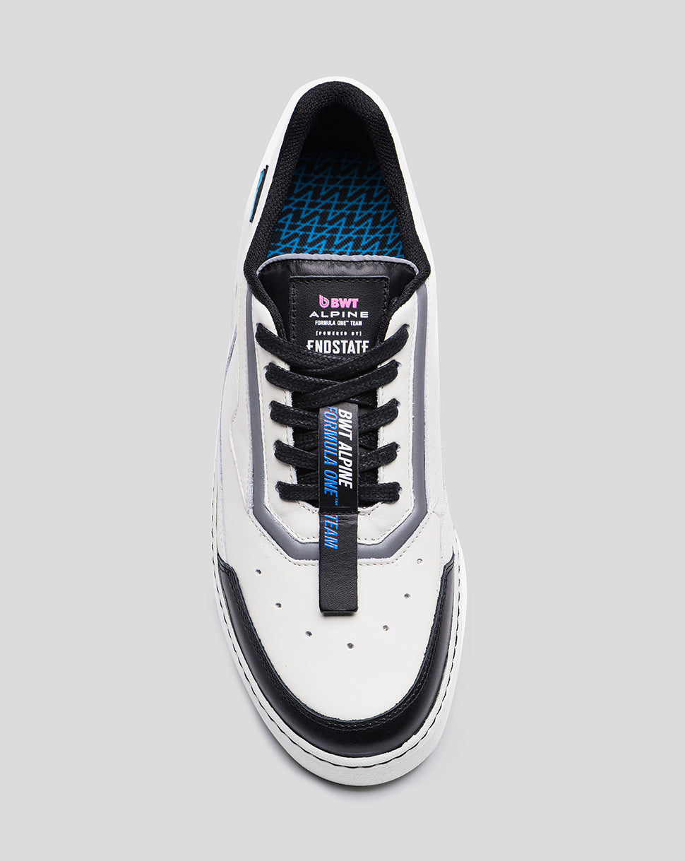 Top-down view of white Endstate sneaker with black laces and blue interior pattern.