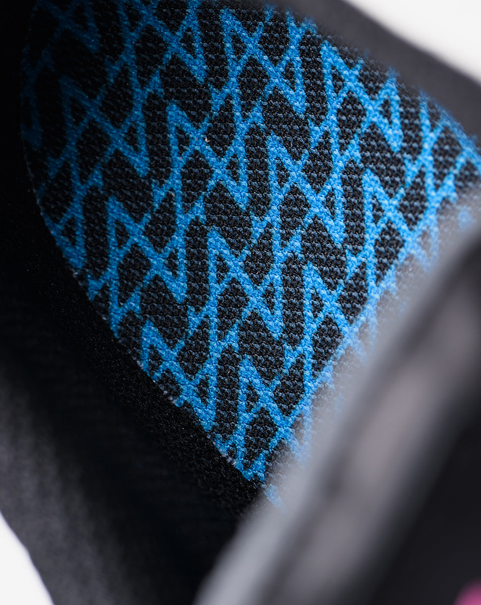 Close-up of blue geometric knit pattern on the Alpine Endstate sneaker fabric.