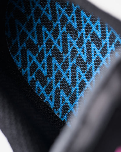 Close-up of blue geometric knit pattern on the Alpine Endstate sneaker fabric.