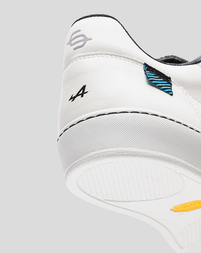 Rear side view of white Alpine Endstate sneaker with blue striped heel patch and A4 logo.