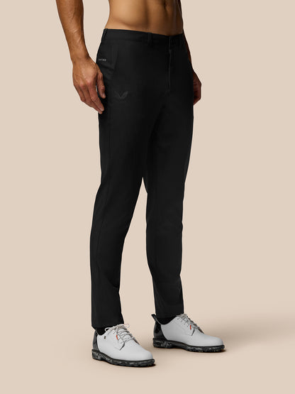 Front view of black Club Golf Trousers on a male model showing belt loops side pockets and Castore branding on the right thigh
