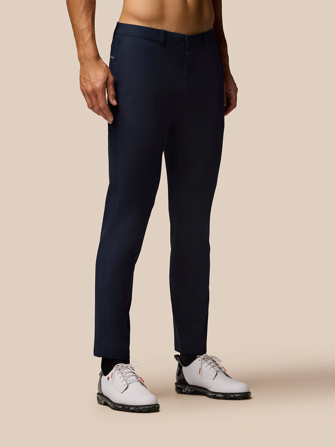 Midnight blue golf trousers with side pockets and a welt back pocket.