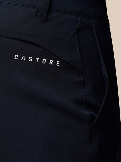 Close-up of navy golf trousers back pocket area with Castore branding.