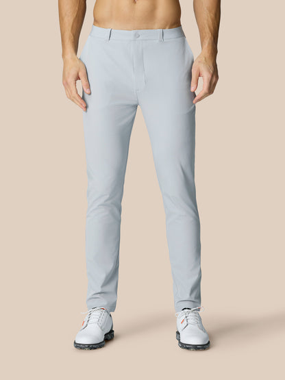 Front view of mid grey Golf Club Trousers on a model highlighting slim fit with belt loops and pockets.