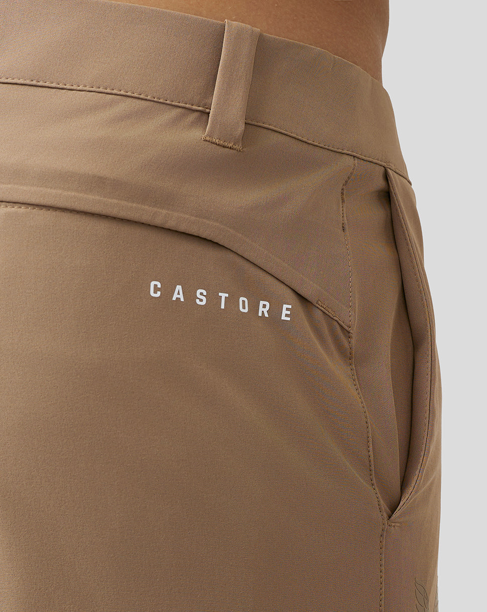 Beige golf shorts close up at the waist with belt loop and Castore branding on the right thigh and rear
