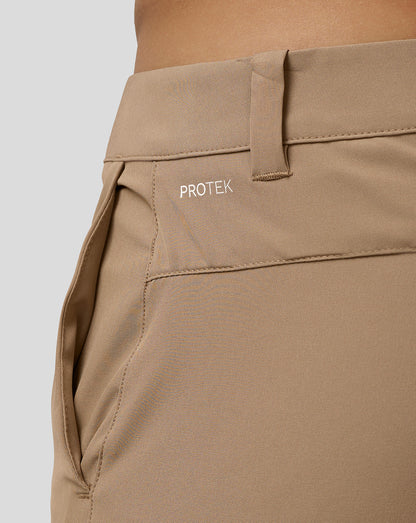 Beige golf shorts close up of back pocket area with Protek branding on the left rear waistband