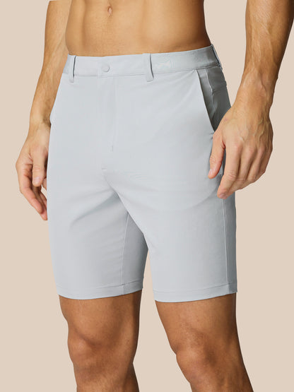 Close up of light grey golf shorts waist area showing belt loops and front seam