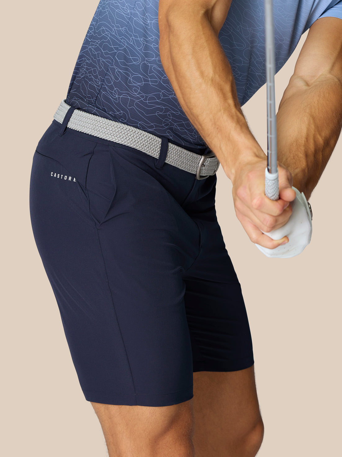 Back view of navy golf shorts highlighting Castore branding on the right thigh and right rear