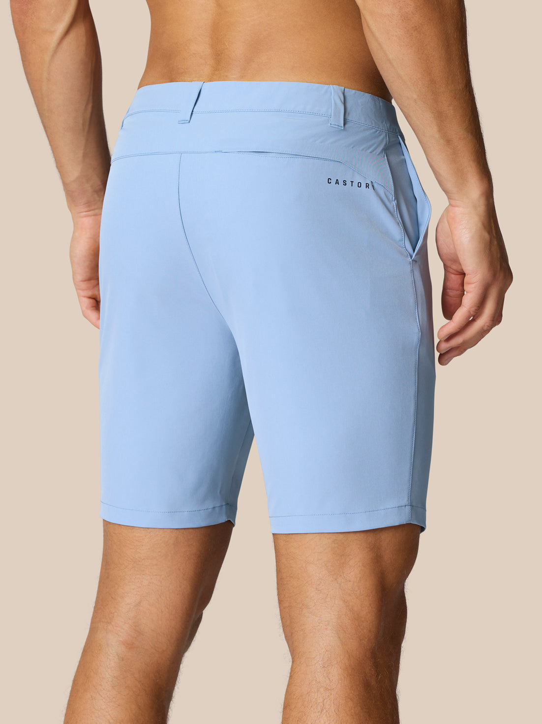 Back view of sky blue Golf Club Shorts with belt loops and a right rear pocket; Castore branding at the thigh and rear