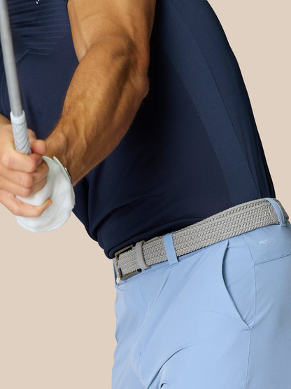 Back view of light blue golf shorts with braided belt and right rear branding