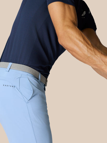Sky blue Castore golf shorts with braided belt, visible belt loops and branding on the right thigh