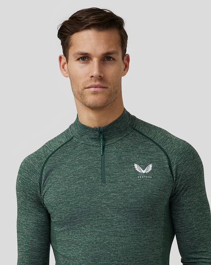 Close-up of pine grey body mapped seamless top showing quarter zip and Castore logo on the left chest.