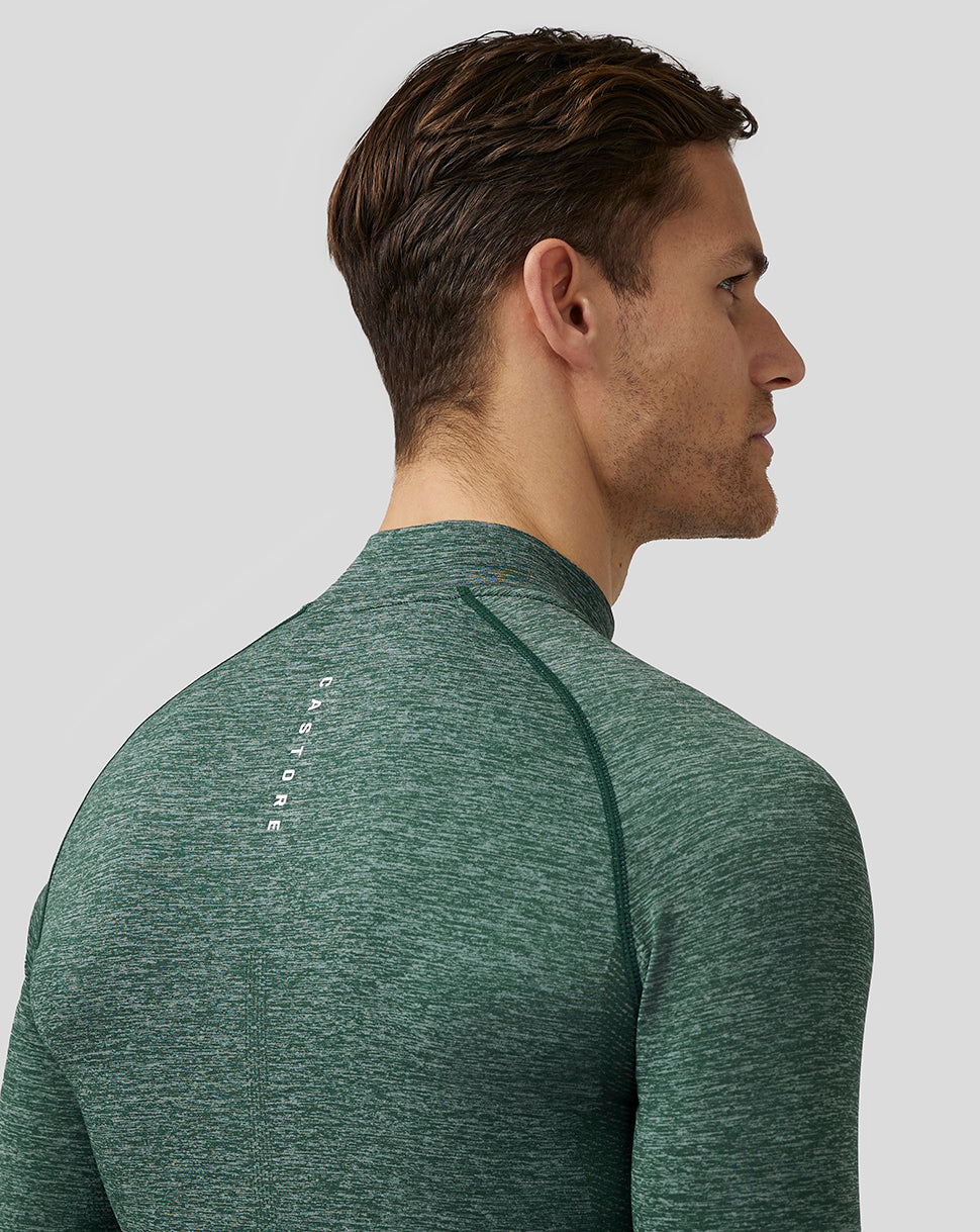Male model wearing pine grey body mapped seamless quarter zip golf top with stand collar
