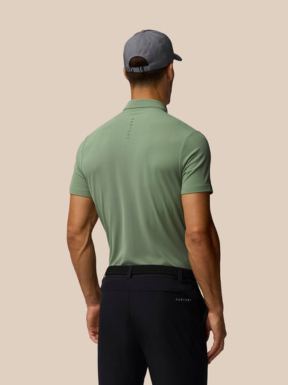 Back view of male model in Thyme Golf Club Essential Polo with Castore logo down back