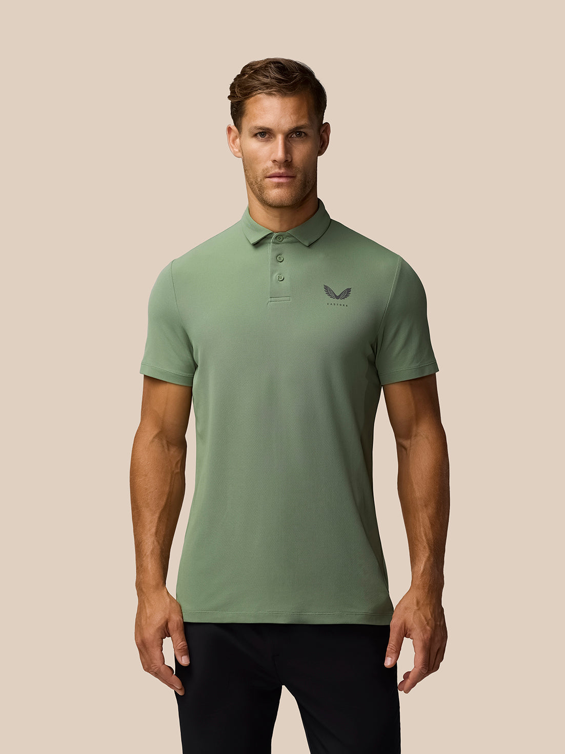 Male model wearing olive green Golf Club Essential Polo with button collar and left chest Castore logo.