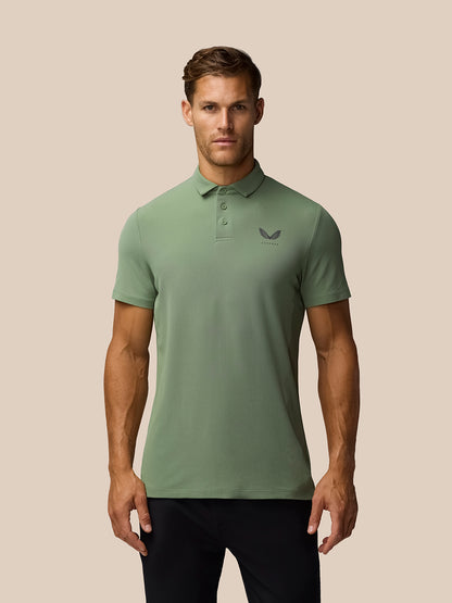 Male model wearing olive green Golf Club Essential Polo with button collar and left chest Castore logo.