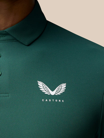 Close-up of green Club Golf Polo fabric with left chest white Castore logo.