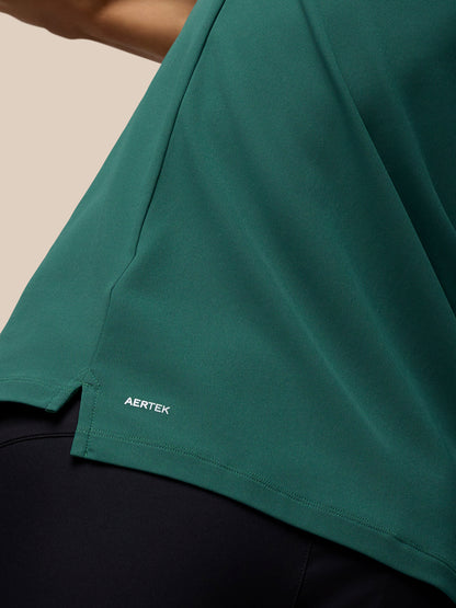 AERTEK branding on the lower back hem of the green Club Golf Polo