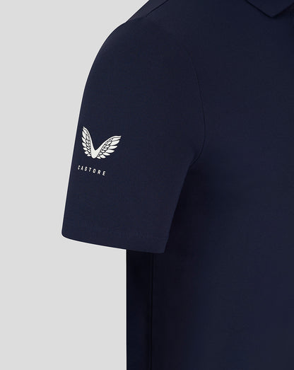 Navy polo sleeve displaying the white Castore wing logo with CASTORE text