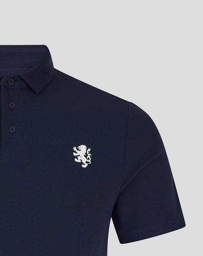 Close-up of navy polo showing white lion crest on left chest