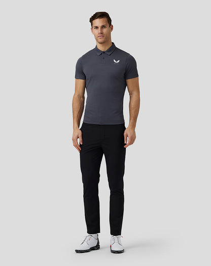Front view of a male model wearing a pewter Pinnacle Knit Polo with Castore logo on the left chest