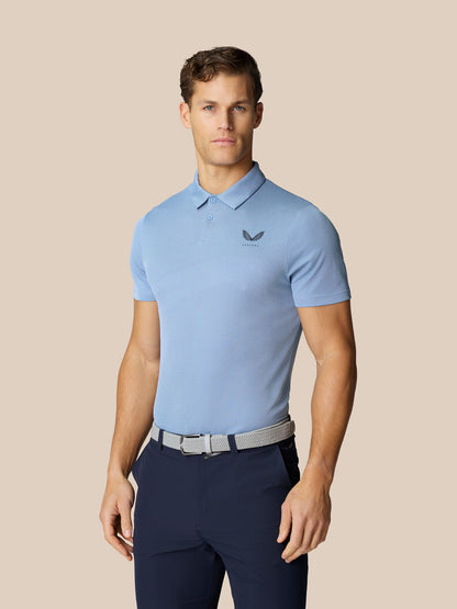 Male model wearing Sky Blue Golf Pinnacle Polo with collar and short sleeves