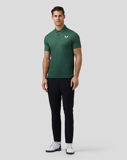 Front view of a man in a green hex pattern golf polo with a left chest Castore logo.