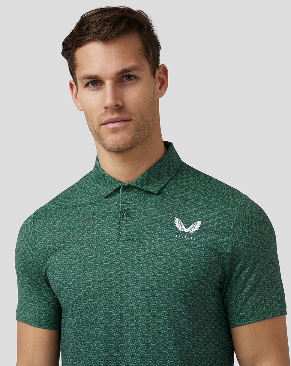 Male model wearing green hex pattern golf polo with Castore logo on left chest
