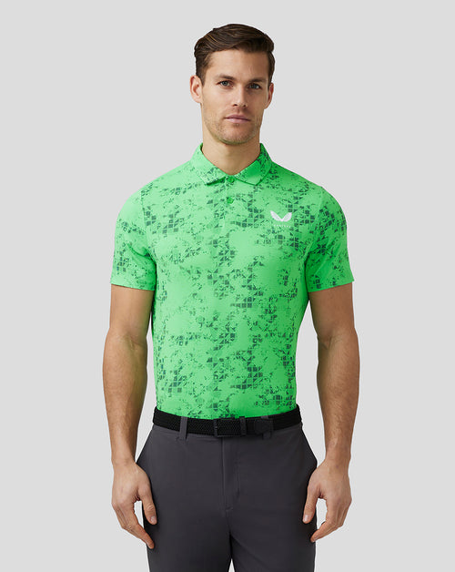 Male model in a bright lime geo printed golf polo with a white Castore logo on the left chest