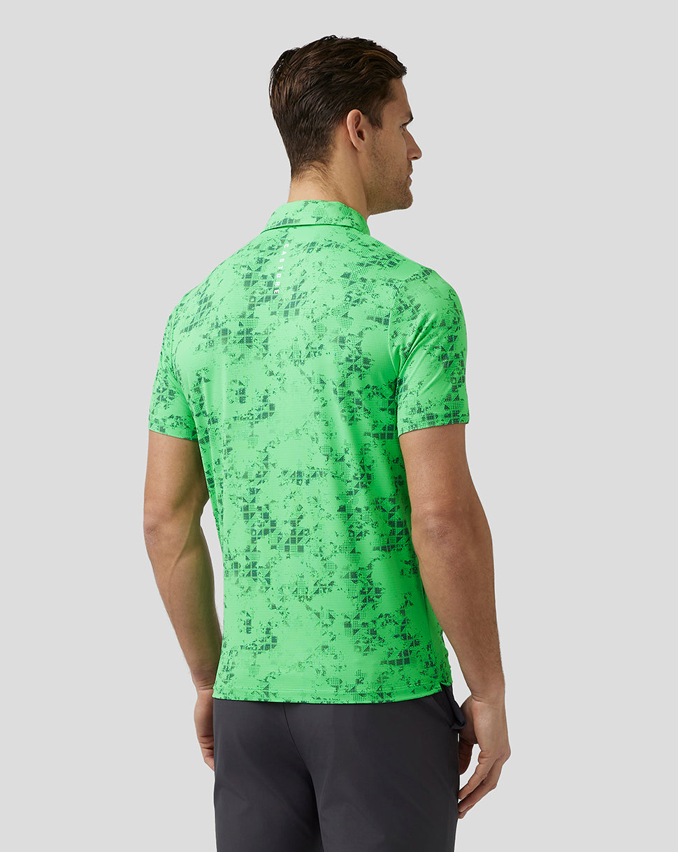 Back view of a male model wearing a lime geometric printed polo with short sleeves
