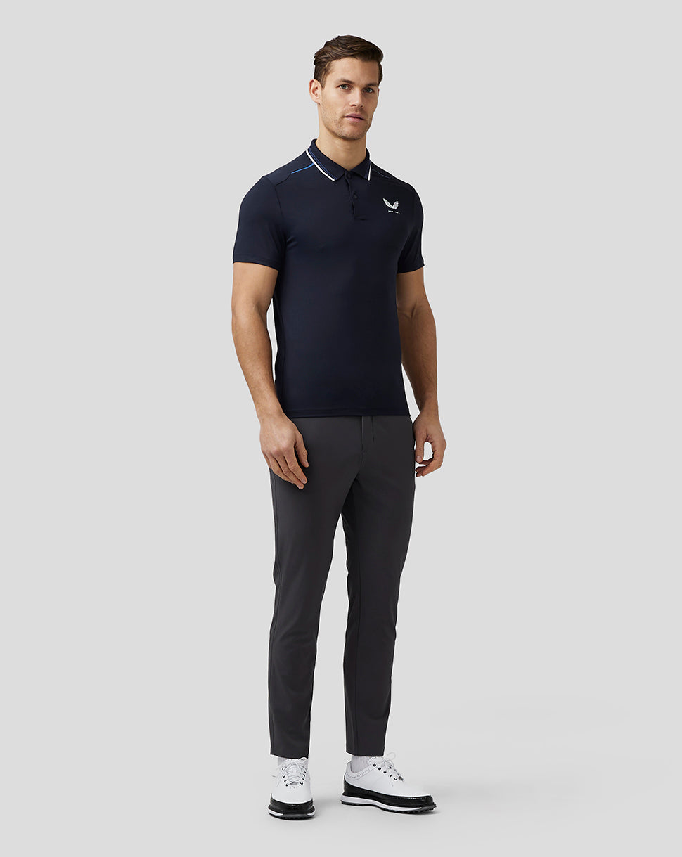 Front view of navy golf tech polo featuring striped collar and left chest logo.