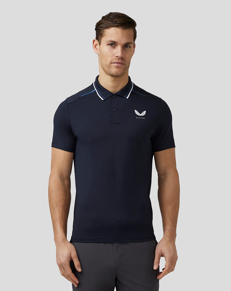 Front view of navy golf polo on a model with left chest crest and white collar trim.