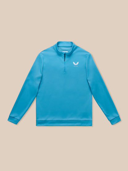 Corn blue golf quarter zip top with stand collar and Castore branding on chest and back.