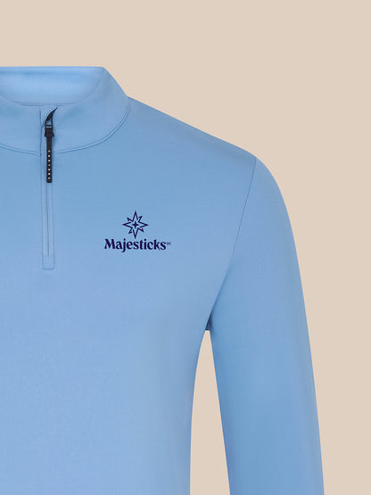 Close-up of sky blue Majesticks ¼ Zip Top left chest showing Majesticks logo.