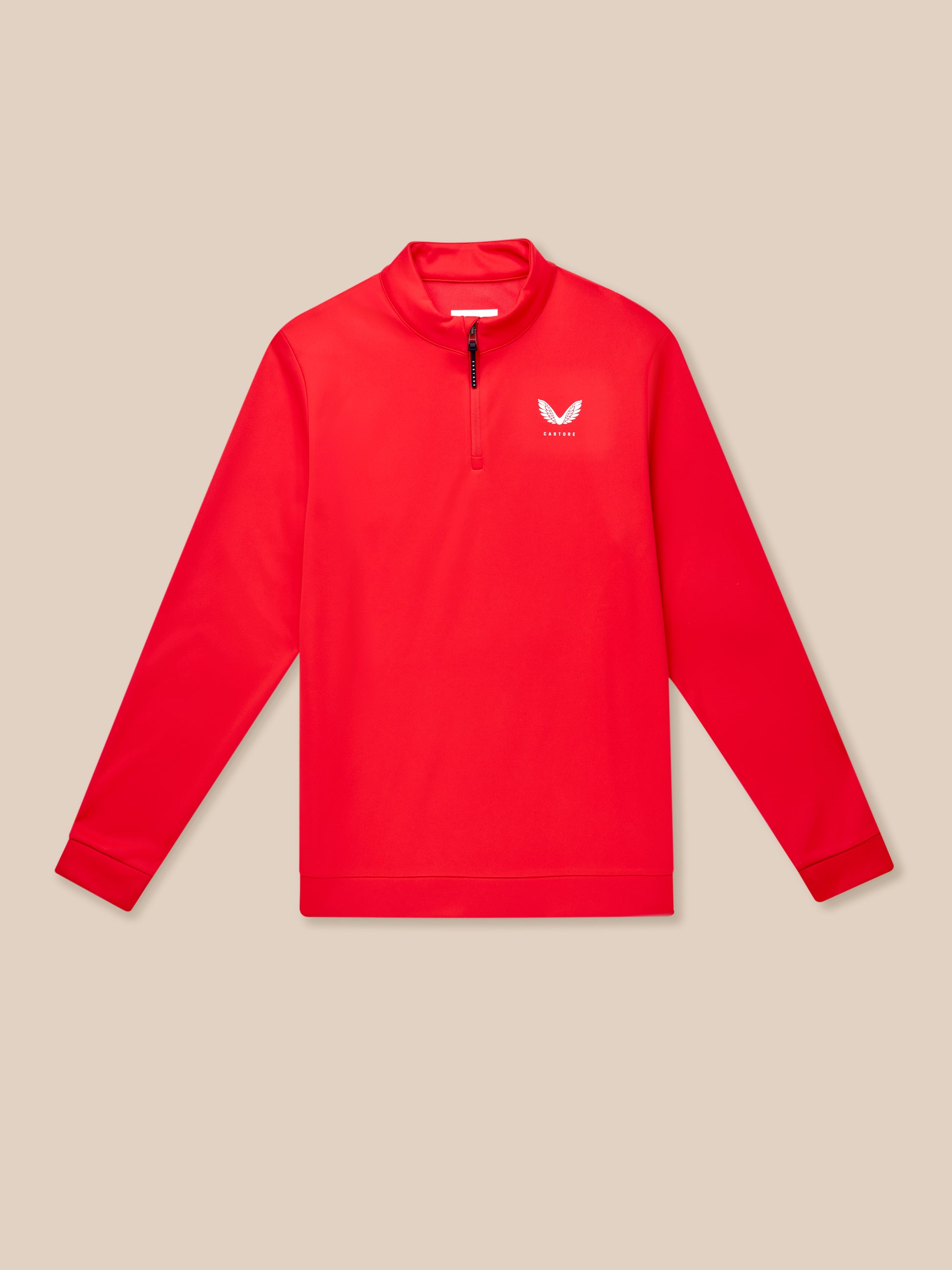 Close up of red golf long sleeve top with zip at the neck and Castore logo on the left chest