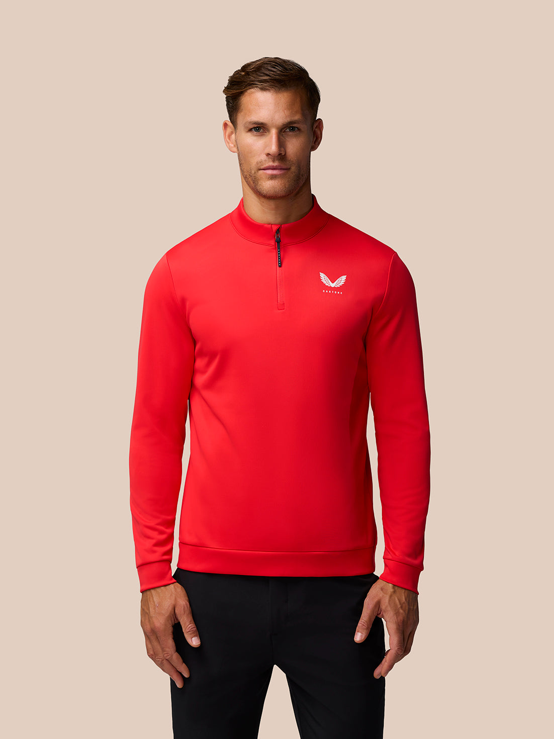 Male model wearing red Golf Club Classic 1/4 Zip Top with stand collar and front zipper, Castore logo on chest