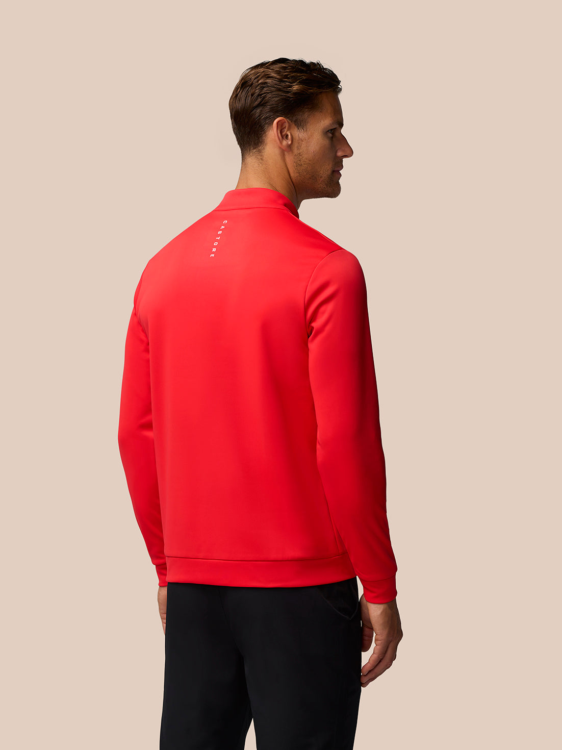 Back view of poppy red Golf Club Classic 1/4 Zip Top with Castore branding on upper back