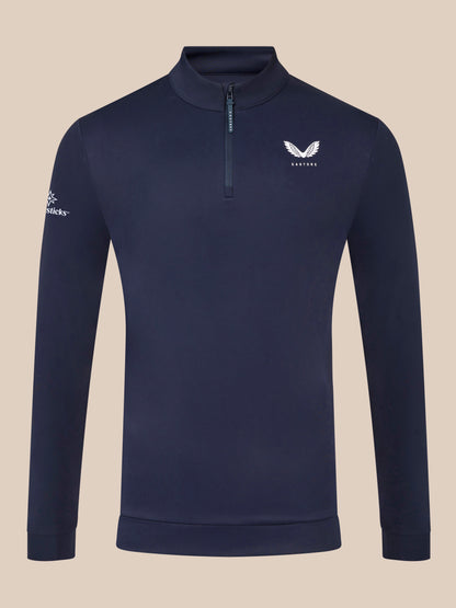Male model in midnight navy Castore Golf Club Classic quarter zip top showing chest and back logos