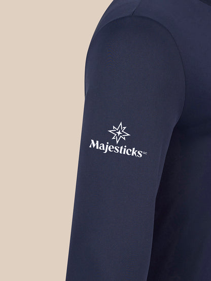 Close up of navy golf top sleeve with Majesticks logo and star emblem