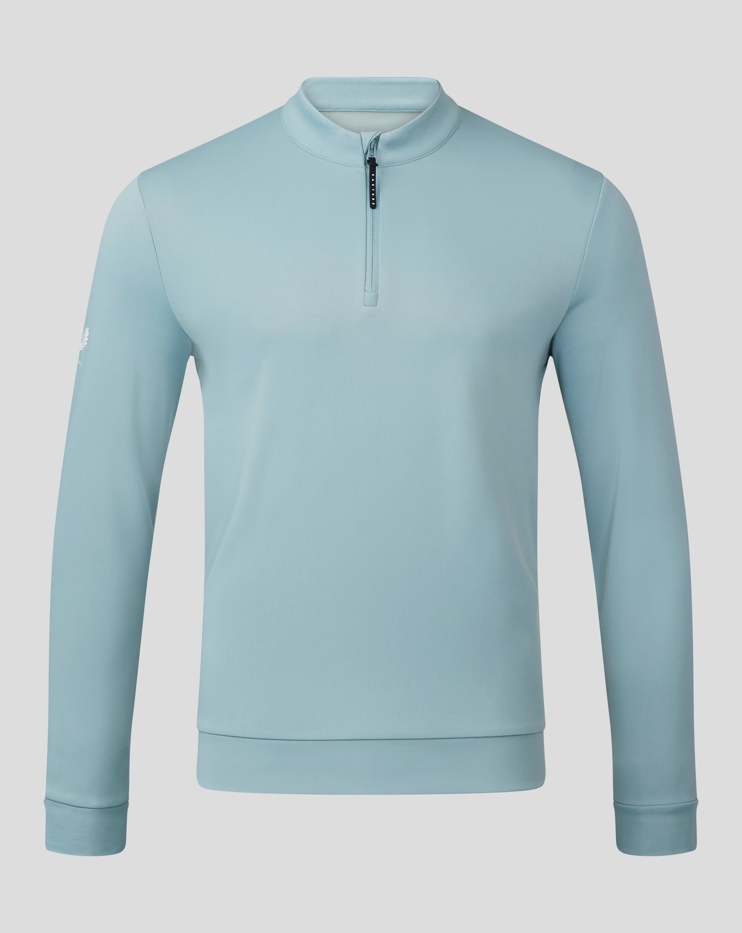 Classic 1/4 Zip in stone blue shown from the chest up with a short zipper and stand collar.