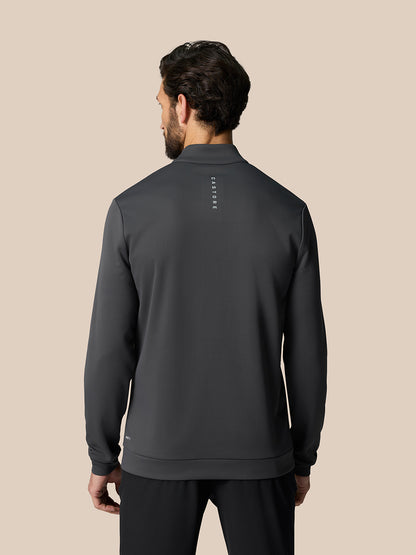 Back view of male model wearing gunmetal Golf Club Classic 1/4 Zip Top with branding on upper back.