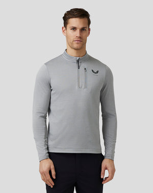 Front view of a man in a light grey Pinnacle Tech Half Zip Top with stand collar center front zip and left chest Castore logo