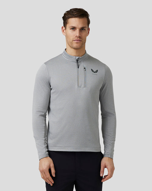 Front view of a man in a light grey Pinnacle Tech Half Zip Top with stand collar center front zip and left chest Castore logo