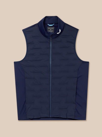 Flat lay of navy Pinnacle Gilet with full front zip and stand collar Castore logo on the collar.