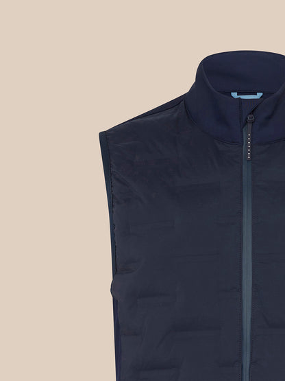 Close-up of navy Majesticks Hybrid Gilet front with center zipper and Majesticks logo on the chest