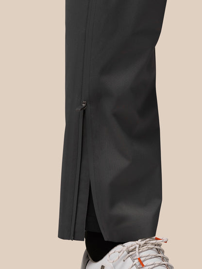Close-up of lower leg with ankle zipper and Castore branding on gunmetal fabric