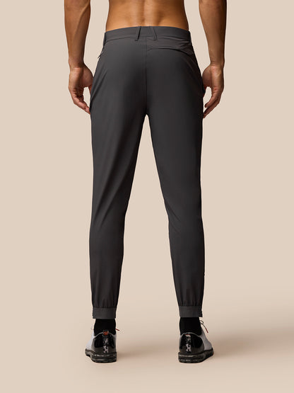 Charcoal golf joggers on a model, back view showing waistband and rear branding