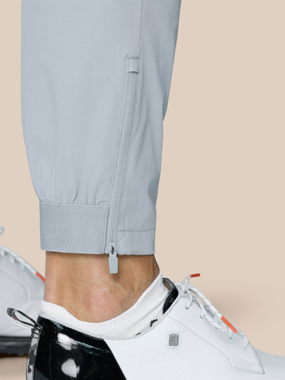 Rear view of light grey Golf Pinnacle Trousers showing branding on the right rear and clean seam lines