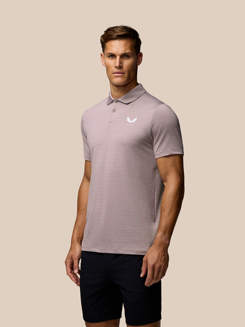 Pink yarn-dye stripe golf polo laid flat with short sleeves and two-button placket Castore branding on left chest
