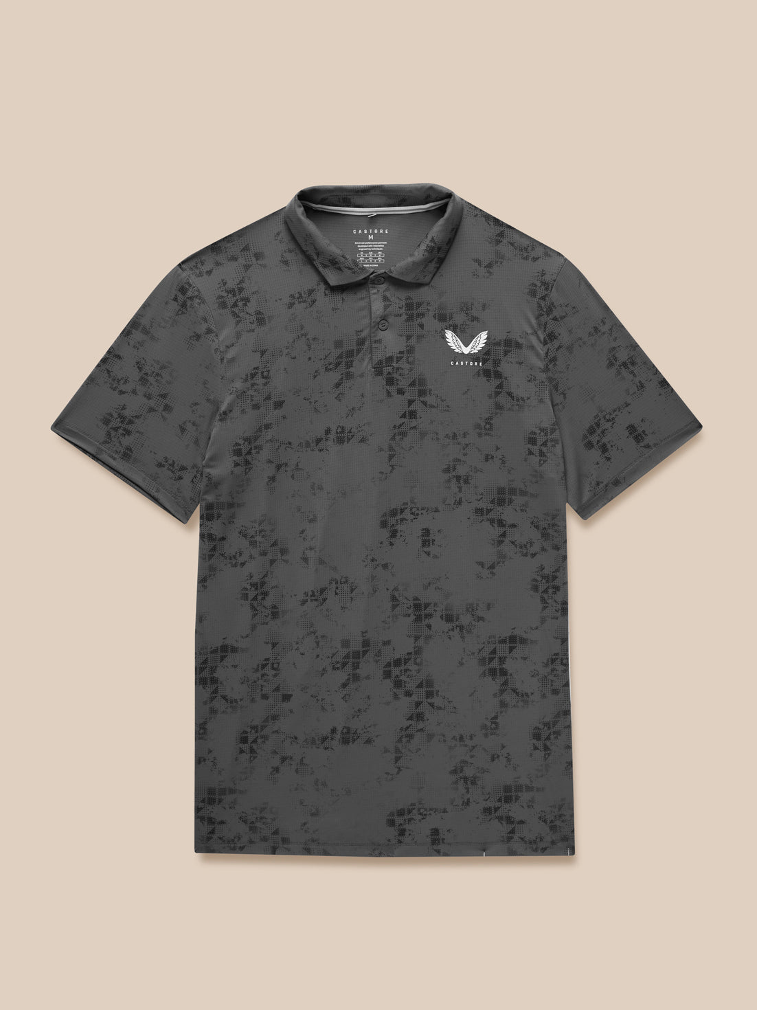Charcoal geo print Club Golf Polo on a model with Castore branding visible on left chest
